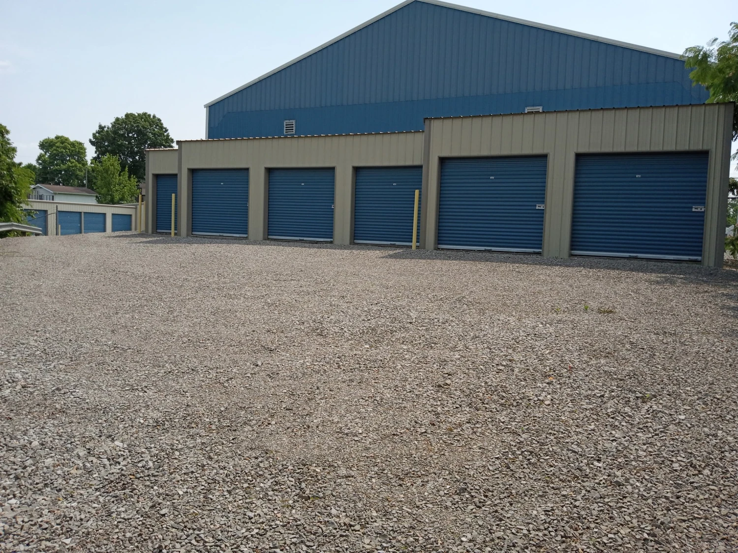 A large storage unit featuring two garage doors, designed for easy access and ample storage space